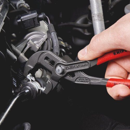  Federbandschellenzangen KNIPEX 85 51 180 A Federbandschellenzange mit rutschhemmendem Kunststoff überzogen grau atramentiert 180 mm 12381273